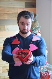 Man holding cheap Valentine Chocolates1