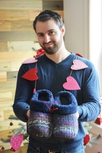 Man holding womans slippers1
