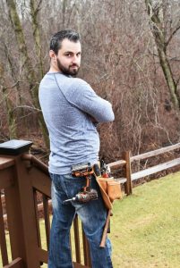 Man with Tool Belt Near Trees1