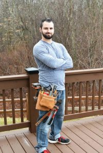 Man with tool belt and tools on porch1